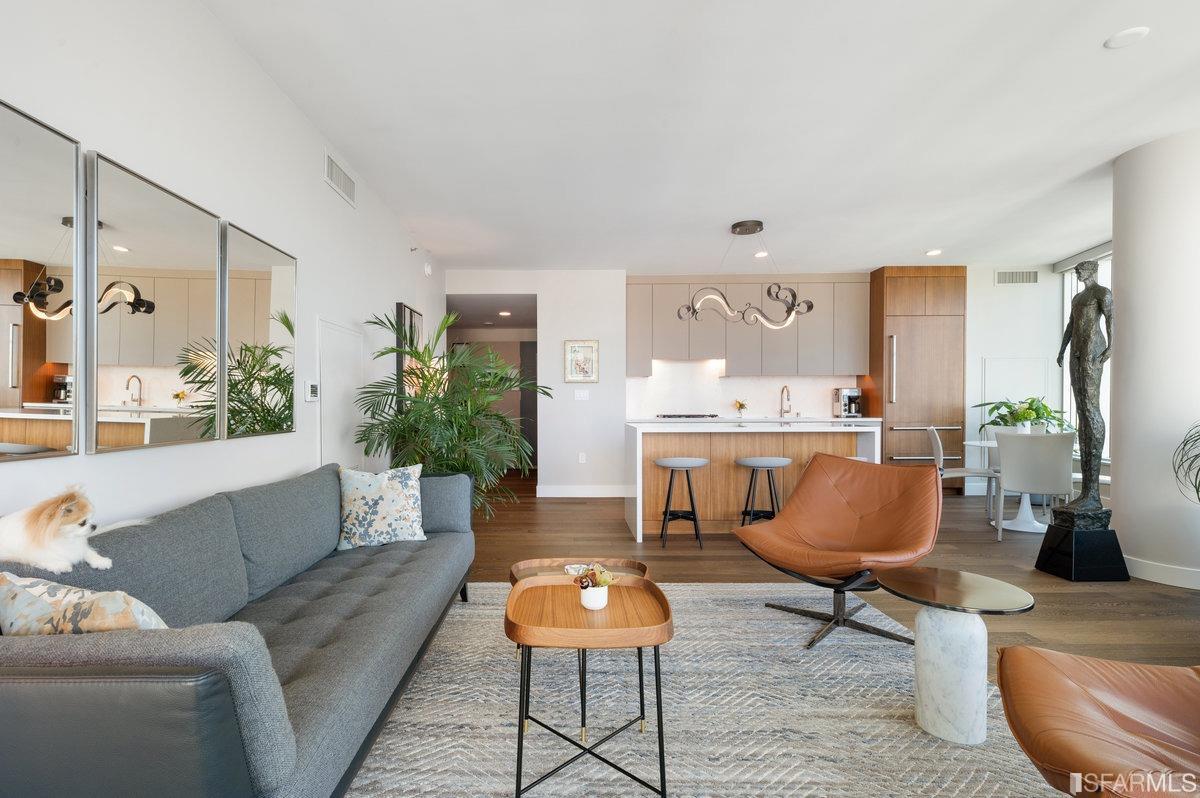 338 Spear Street, Unit 39E San Francisco, CA 94105 - Photo 3 of 97 a living room with furniture and wooden floor