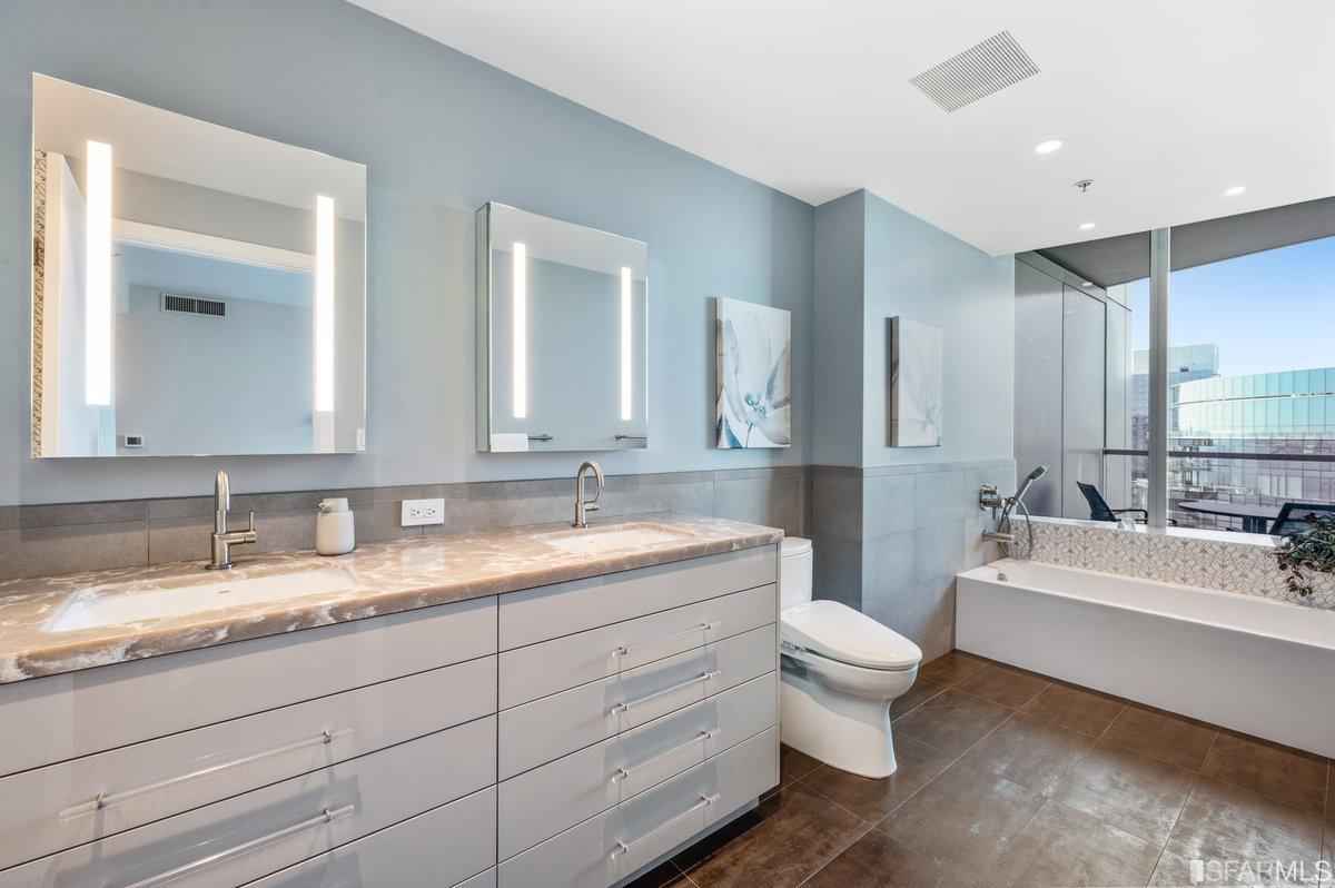 338 Spear Street, Unit 39E San Francisco, CA 94105 - Photo 35 of 97 a bathroom with a double vanity sink mirror double and toilet