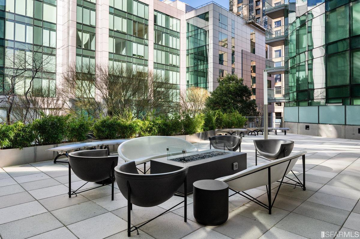 338 Spear Street, Unit 39E San Francisco, CA 94105 - Photo 50 of 97 a view of a patio with table and chairs and potted plants