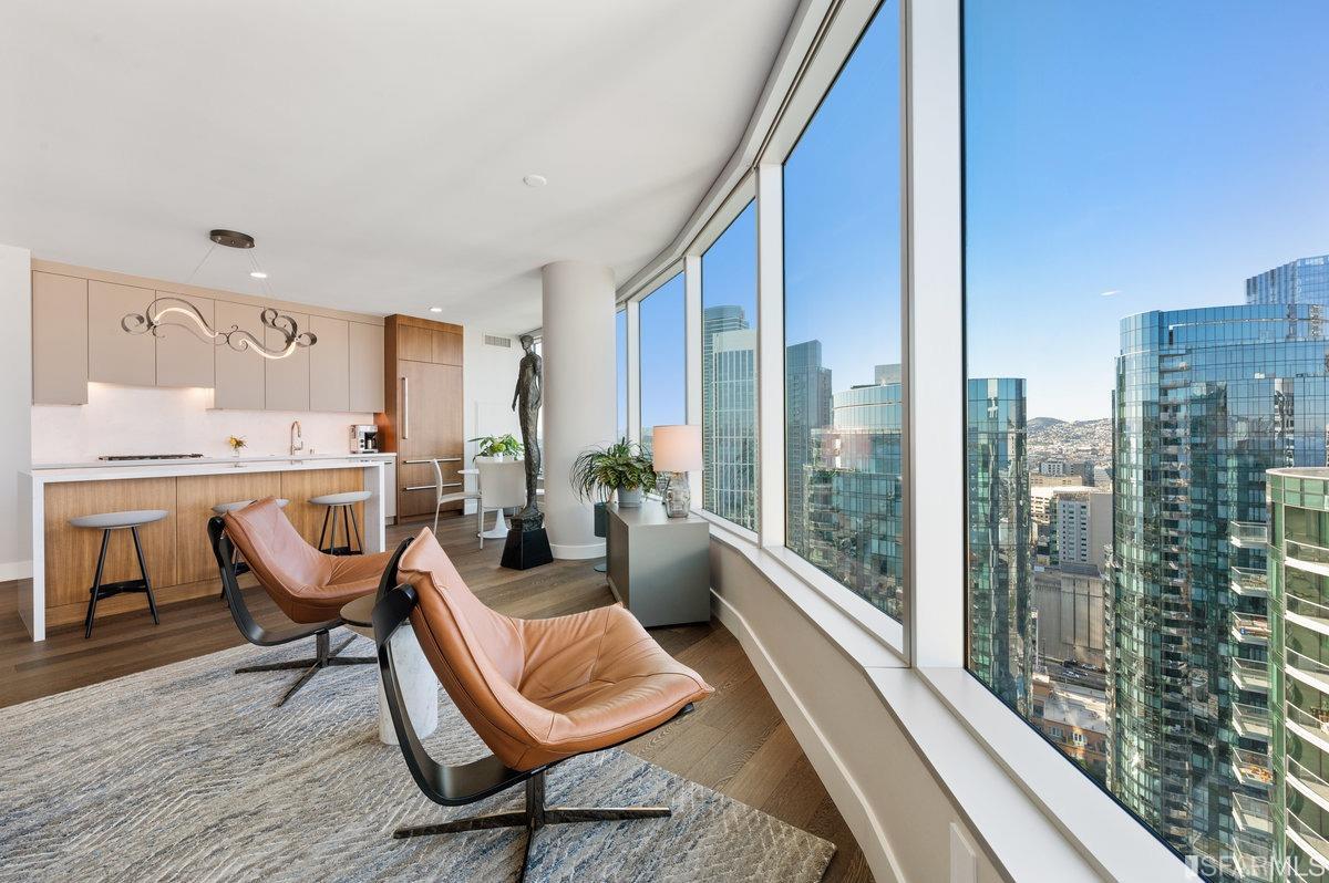 338 Spear Street, Unit 39E San Francisco, CA 94105 - Photo 5 of 97 a room with furniture and a large window