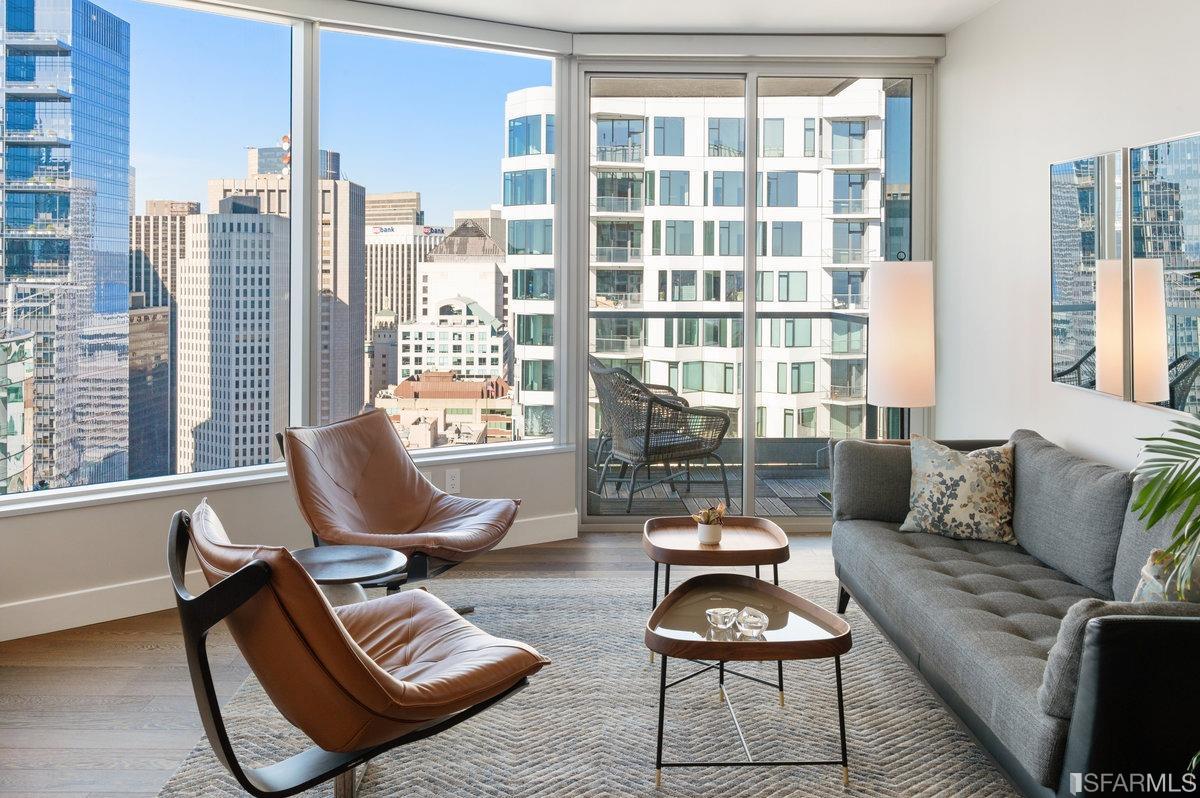 338 Spear Street, Unit 39E San Francisco, CA 94105 - Photo 7 of 97 a living room with furniture and floor to ceiling windows