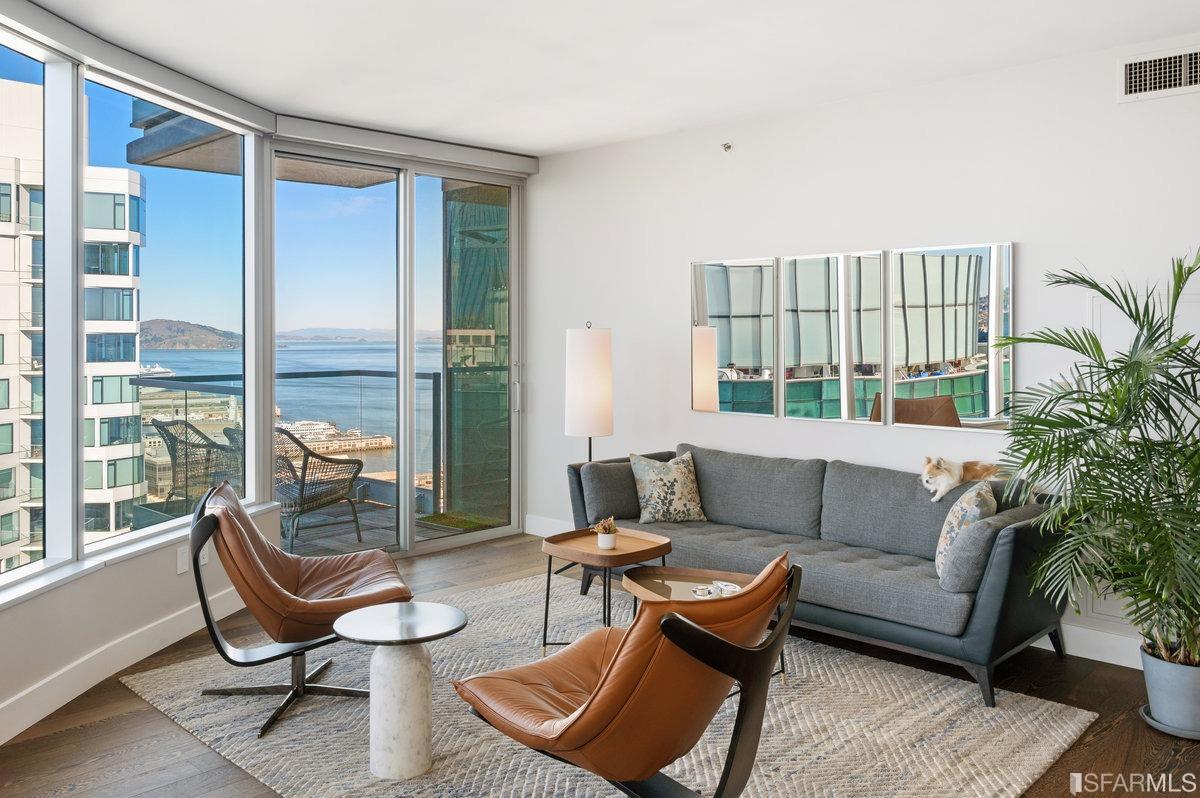 338 Spear Street, Unit 39E San Francisco, CA 94105 - Photo 8 of 97 a living room with furniture and a floor to ceiling window