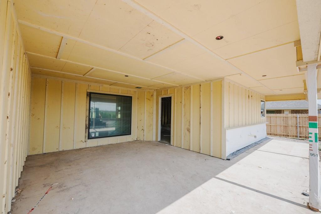1313 Red Rock Road Lorena, TX 76655 - Photo 11 of 13 a view of a big room with windows and cabinet