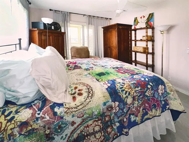 a bedroom with a bed and a dresser