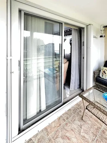 a view of a hallway with windows