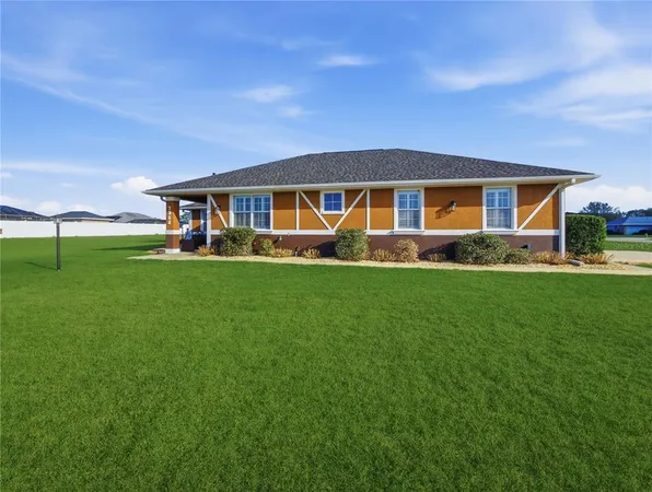 a front view of house with yard outdoor seating and green space