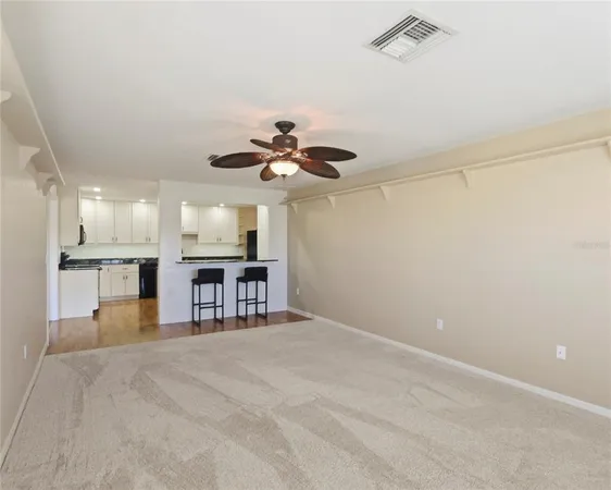 a view of a kitchen with a sink and chandelier