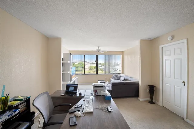 a work room with furniture and window