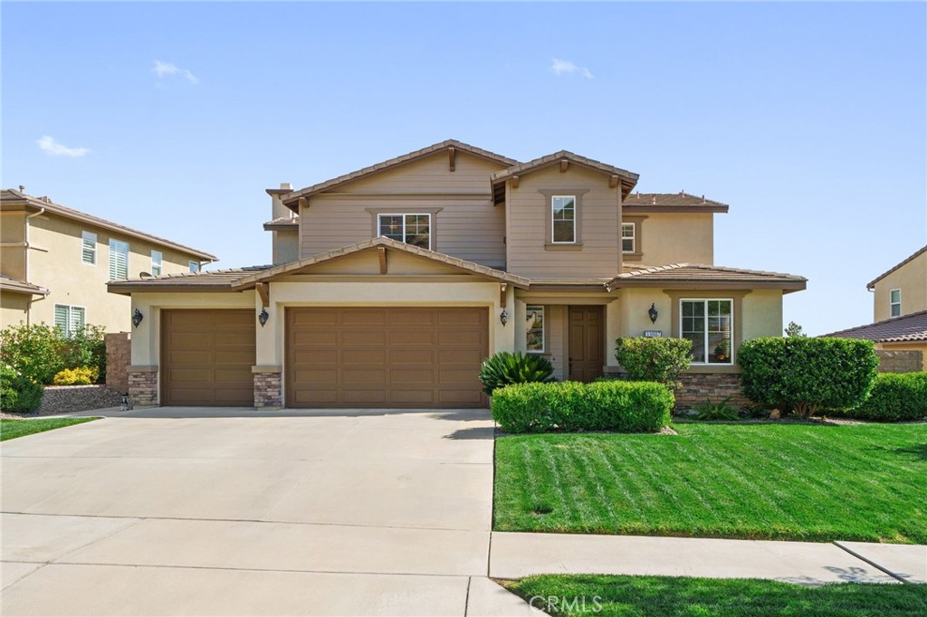 33887 Golden Crown Way Road Yucaipa, CA 92399 - Photo 1 of 1 a front view of a house with a garden and plants