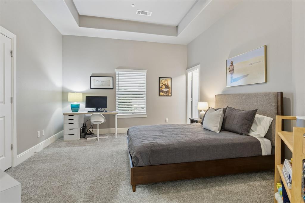 6700 Herbert Road Colleyville, TX 76034 - Photo 23 of 32 a bedroom with a bed and a couch