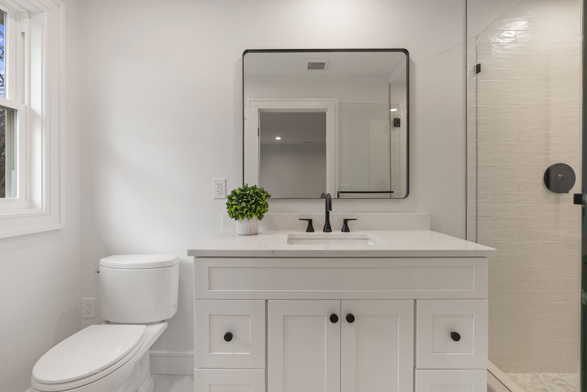 52 Curtis Road Bridgewater, CT 06752 - Photo 16 of 25 a bathroom with a sink toilet a mirror and shower