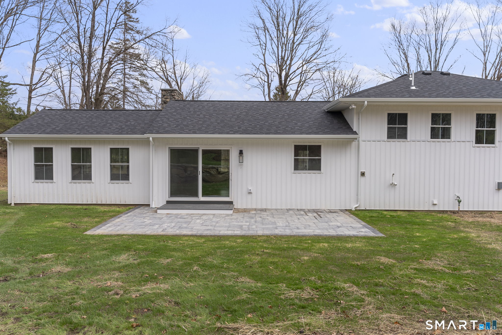 52 Curtis Road Bridgewater, CT 06752 - Photo 19 of 25 a front view of a house with a garden