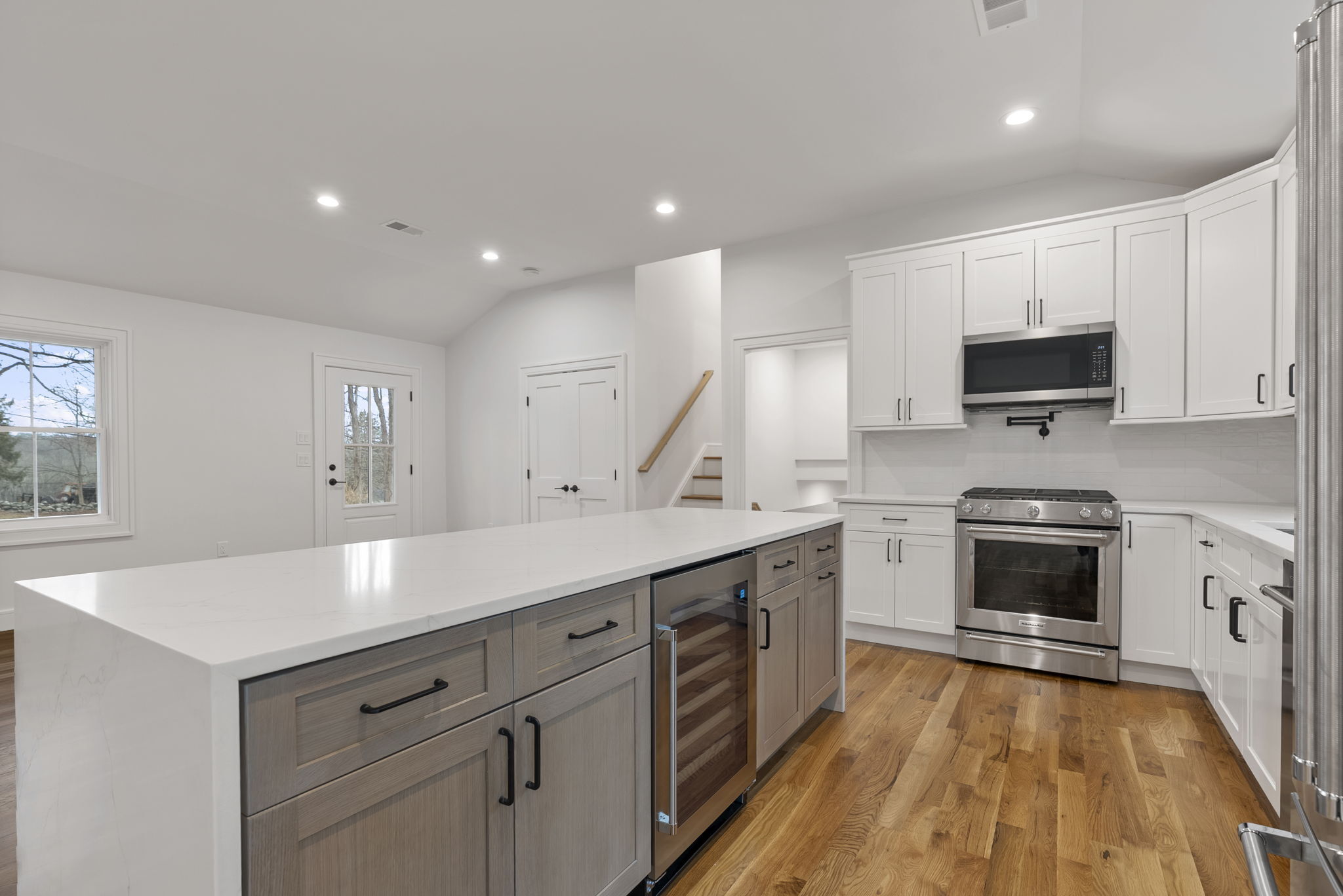 52 Curtis Road Bridgewater, CT 06752 - Photo 24 of 25 a large kitchen with stainless steel appliances granite countertop a stove a sink and a microwave