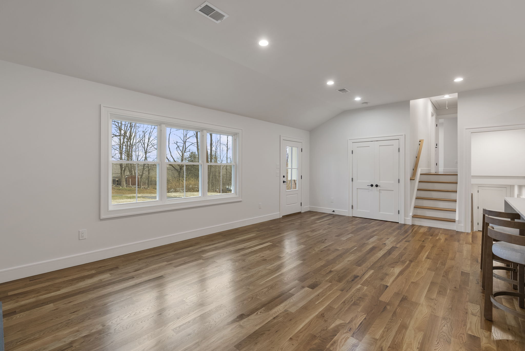 52 Curtis Road Bridgewater, CT 06752 - Photo 7 of 25 a view of an empty room with a window and wooden floor