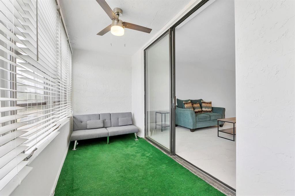 2840 Somerset Drive, Unit 205M Lauderdale Lakes, FL 33311 - Photo 18 of 22 a bedroom with a bed and a view of bedroom