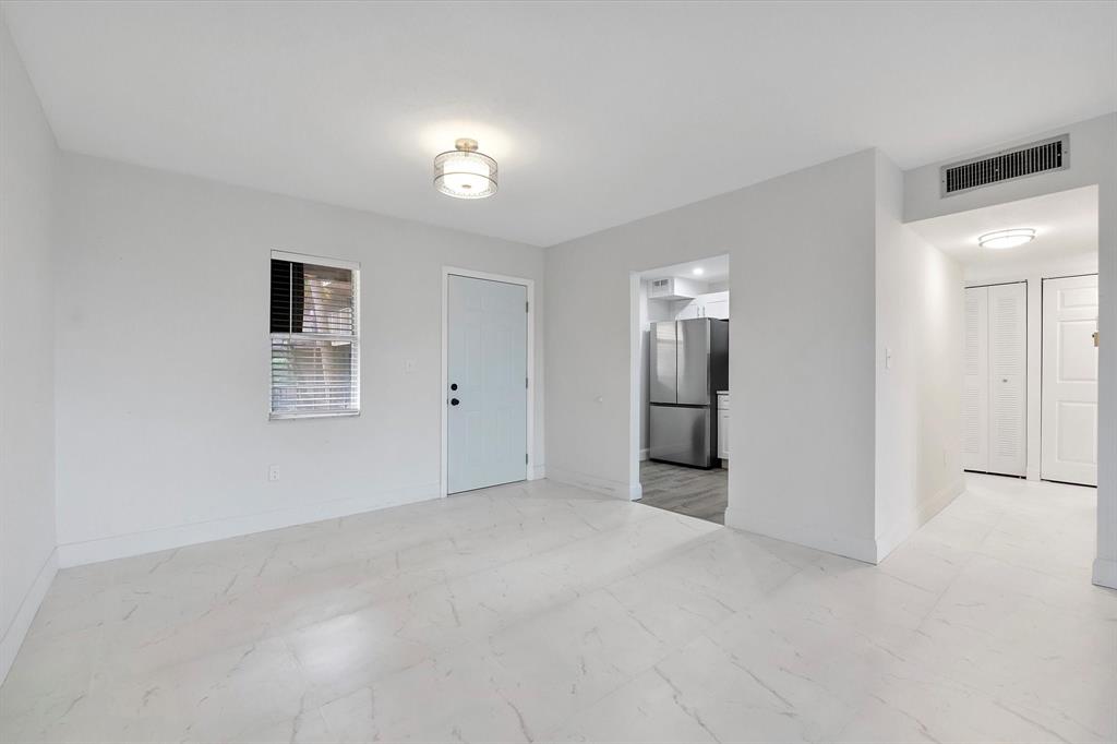 2840 Somerset Drive, Unit 205M Lauderdale Lakes, FL 33311 - Photo 9 of 22 an empty room with a bathroom