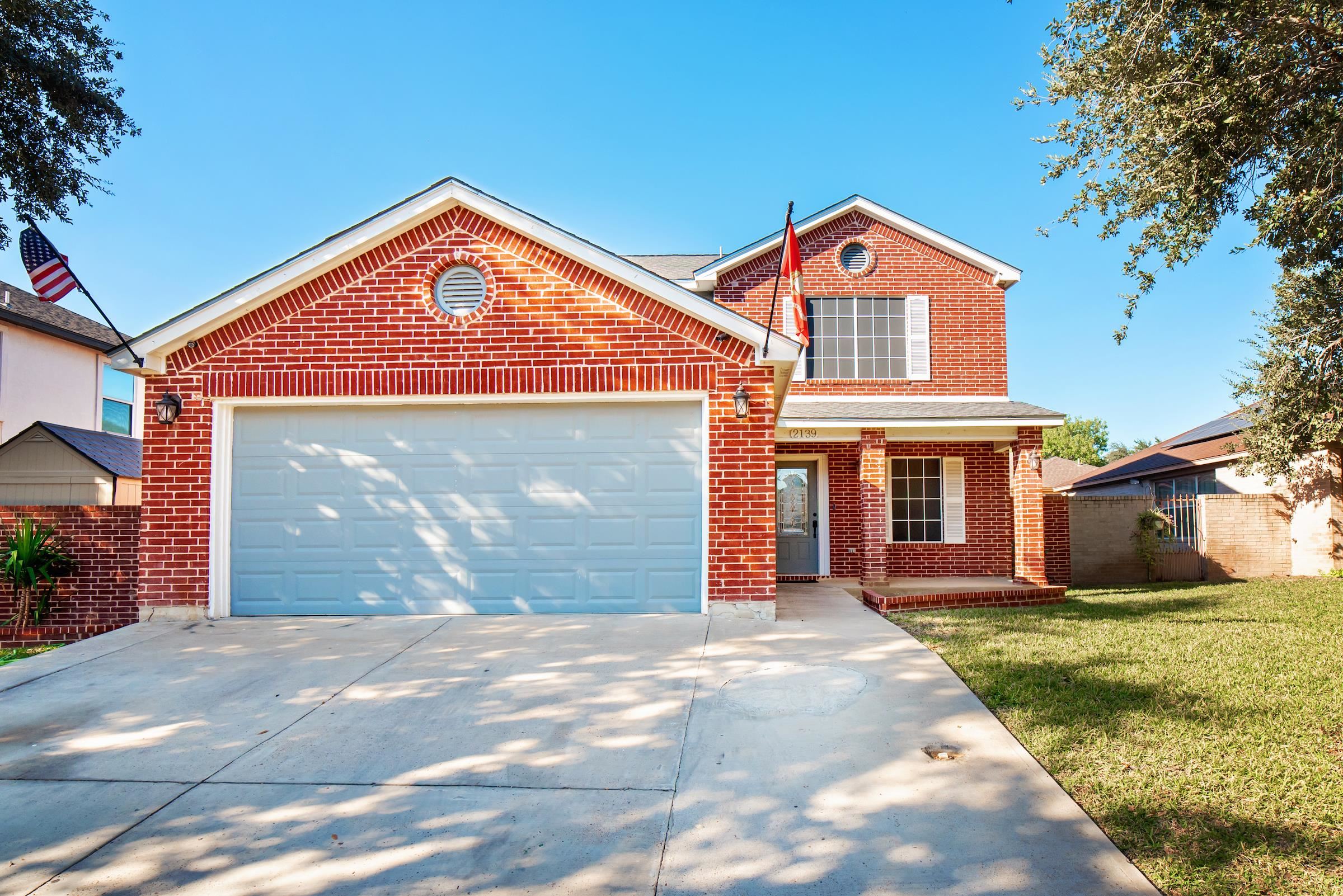 2139 Lima Loop Laredo, TX 78045 - Photo 1 of 1 a front view of house with yard