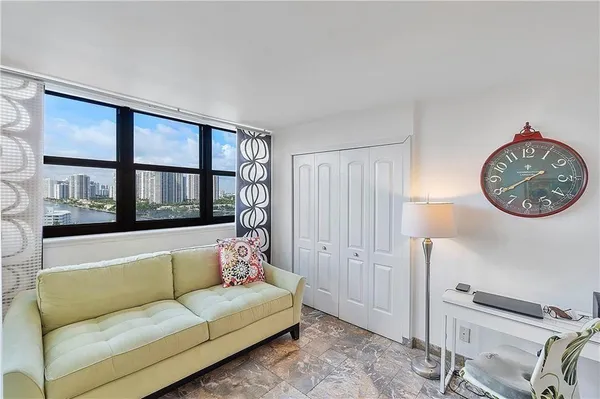 a living room with furniture and a window