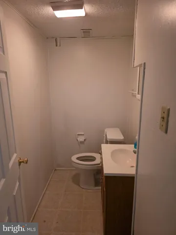 a bathroom with a toilet and a sink