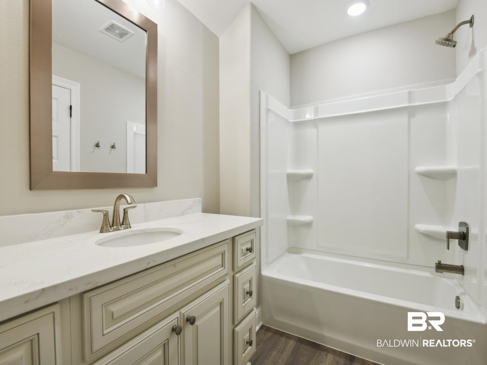 23937 Peppermint Street Elberta, AL 36530 - Photo 16 of 22 Full bath with vanity, wood finished floors, and bathtub / shower combination