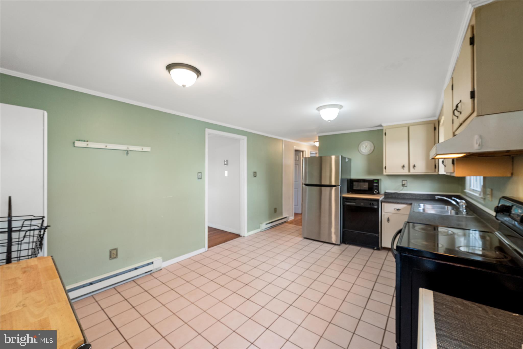 1116 Opequon Avenue Winchester, VA 22601 - Photo 13 of 30 a kitchen with a refrigerator and a sink