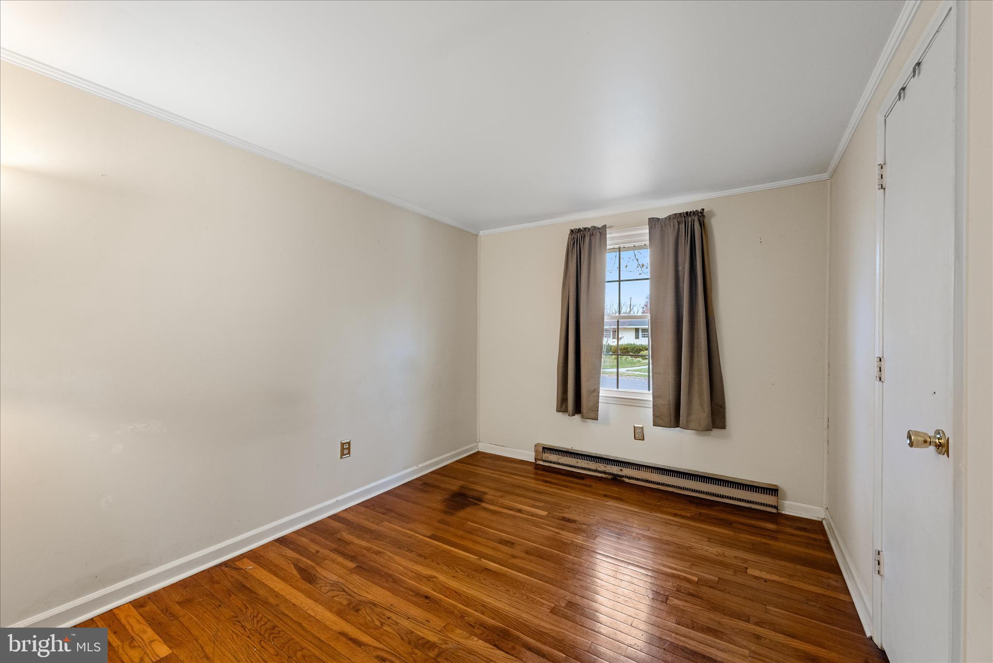 1116 Opequon Avenue Winchester, VA 22601 - Photo 14 of 30 a view of an empty room with wooden floor and a window