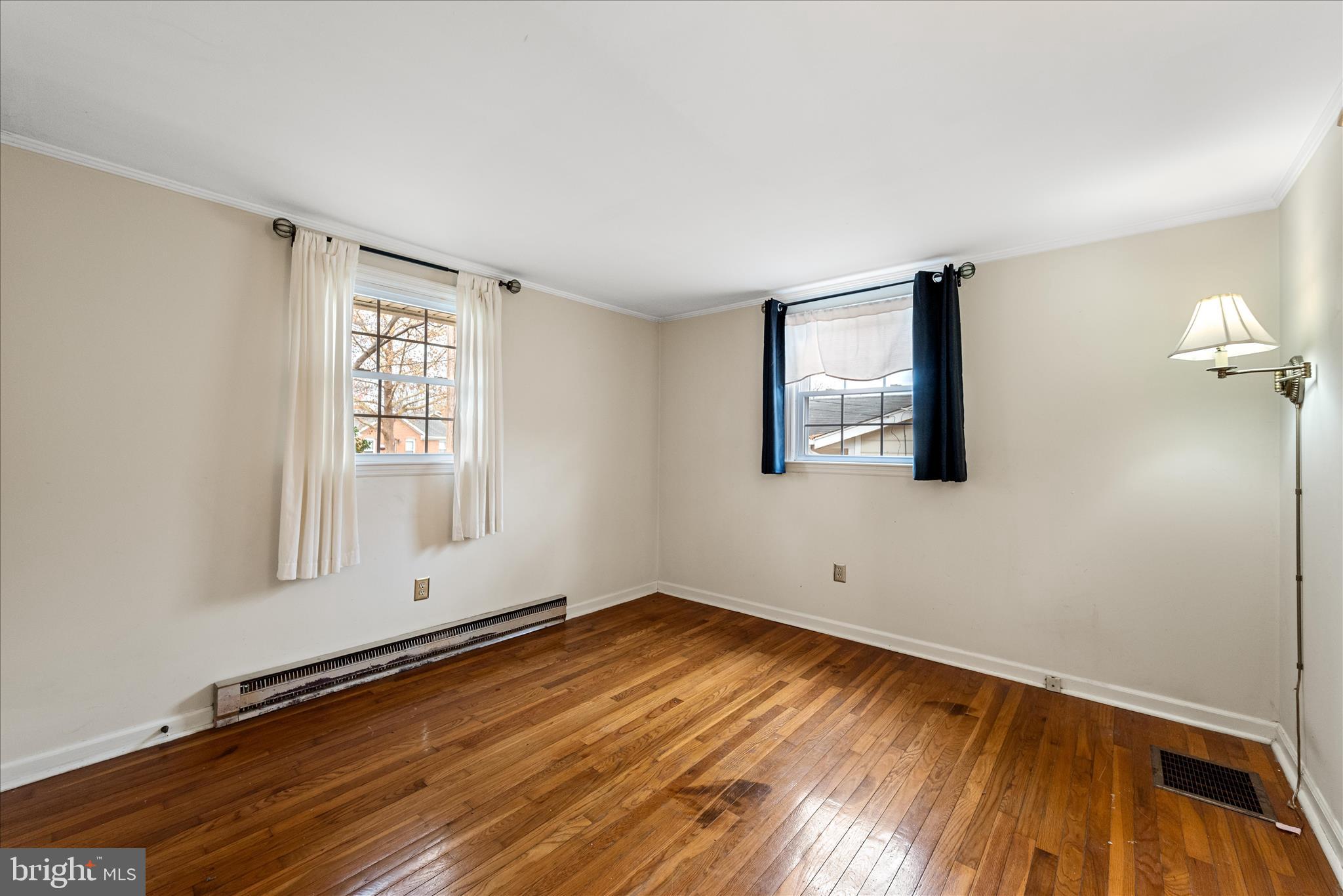 1116 Opequon Avenue Winchester, VA 22601 - Photo 17 of 30 an empty room with wooden floor and windows