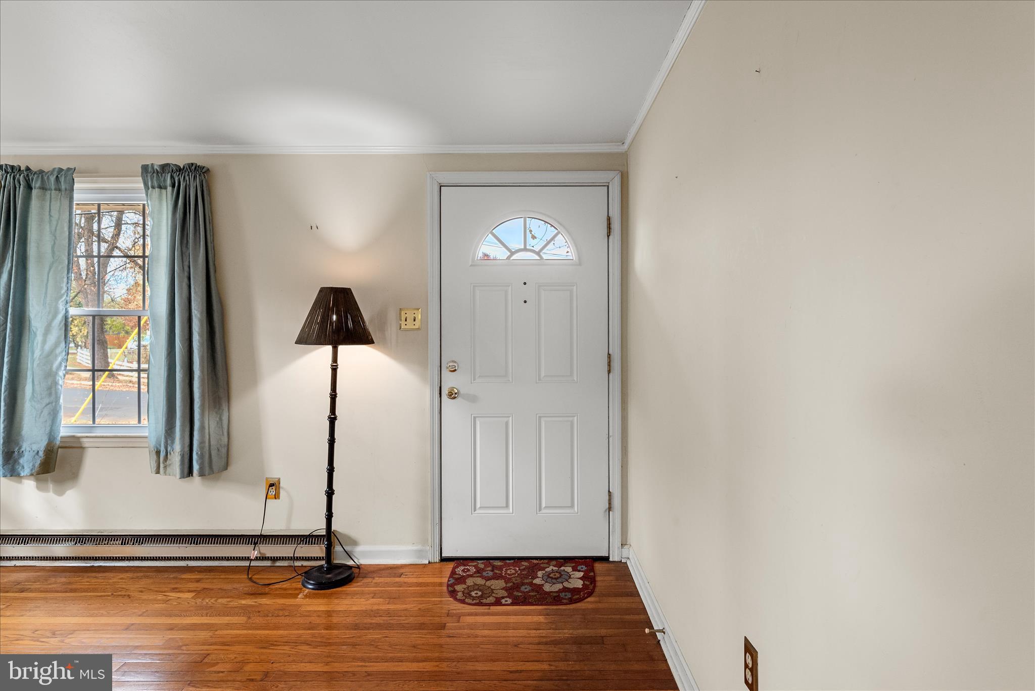 1116 Opequon Avenue Winchester, VA 22601 - Photo 4 of 30 a view of a livingroom with a window and wooden floor