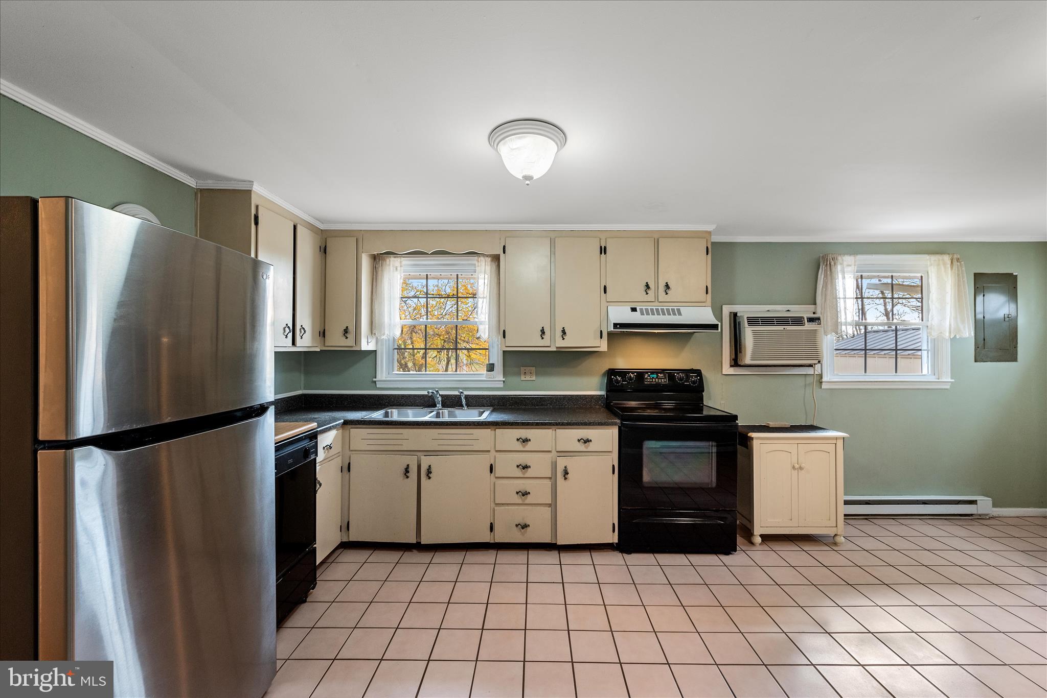1116 Opequon Avenue Winchester, VA 22601 - Photo 7 of 30 a kitchen with stainless steel appliances granite countertop a refrigerator sink and stove
