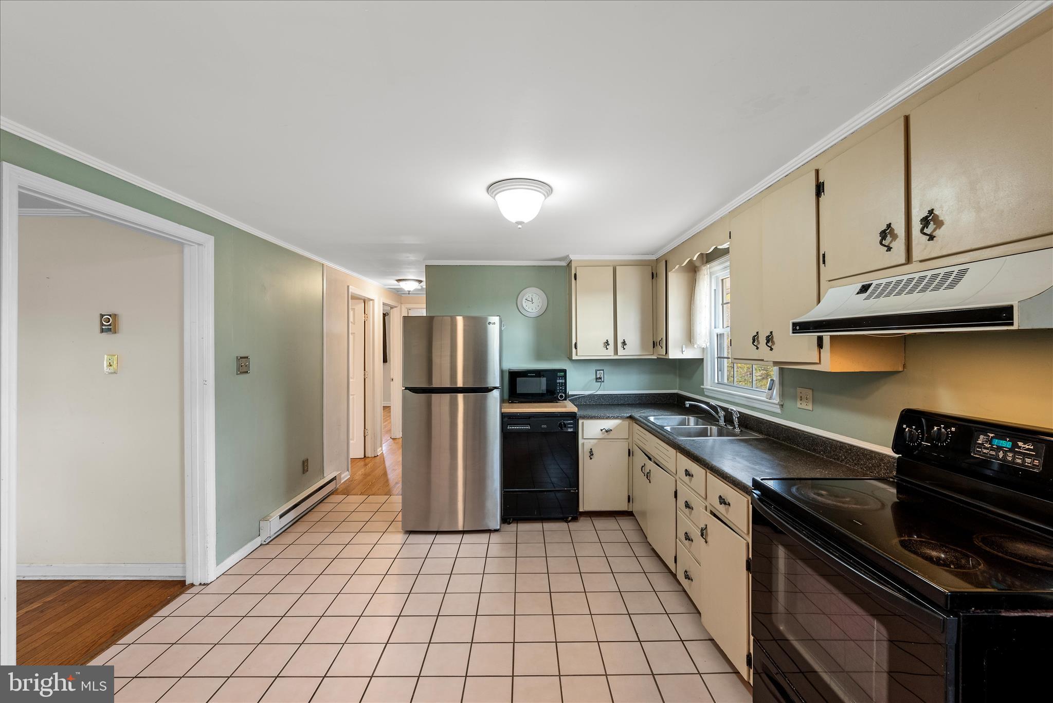 1116 Opequon Avenue Winchester, VA 22601 - Photo 10 of 30 a kitchen with stainless steel appliances granite countertop a refrigerator and a stove top oven