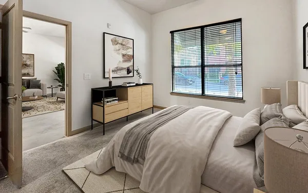 a bedroom with a bed and a dresser