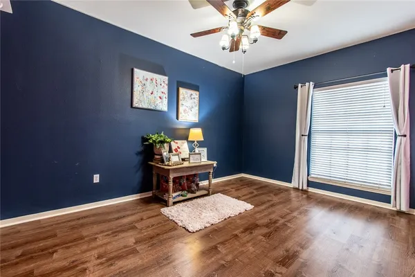 a view of a livingroom with furniture window and wooden floor