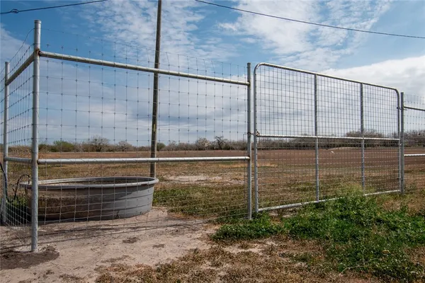 a view of outdoor space with wooden fence