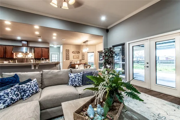 a living room with furniture and a large window
