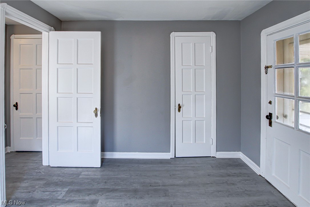 3423 Westbury Road Cleveland, OH 44120 - Photo 12 of 38 Unfurnished bedroom with dark hardwood / wood-style floors and multiple windows