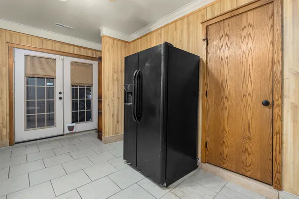 a view of a kitchen with white cabinets and white appliances
