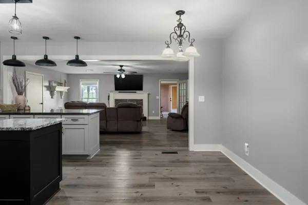 a kitchen with stainless steel appliances granite countertop a stove and cabinets