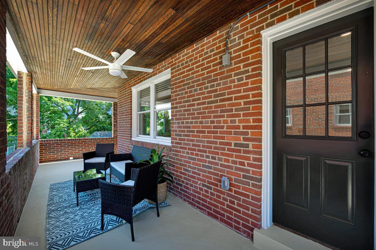 2105 Queens Chapel Road Mount Rainier, MD 20712 - Photo 28 of 33 a balcony with furniture and a potted plant