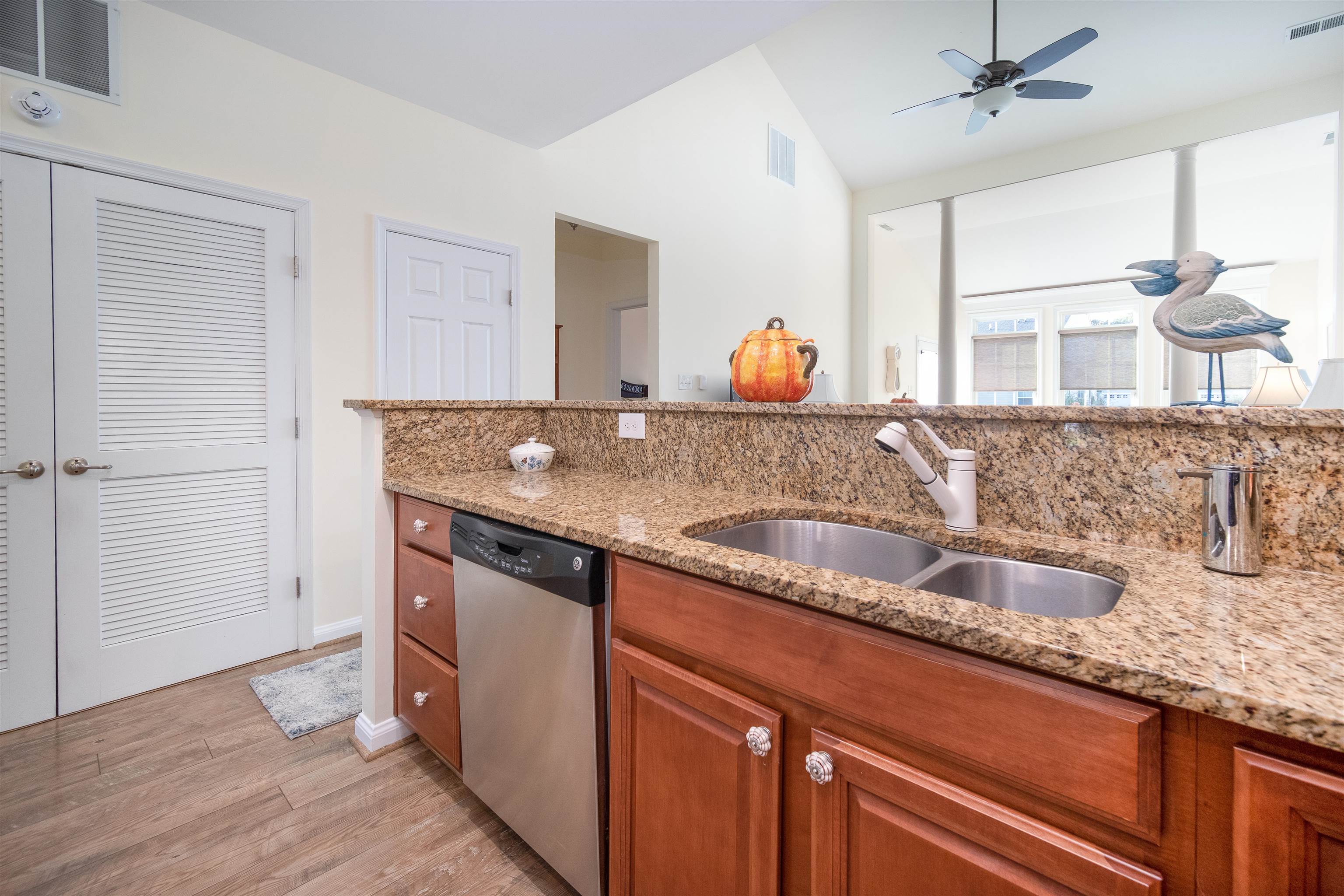 206 Seacrest Lane, Unit 155 Rio Grande, NJ 08242 - Photo 12 of 50 a kitchen with a sink and a wooden floor