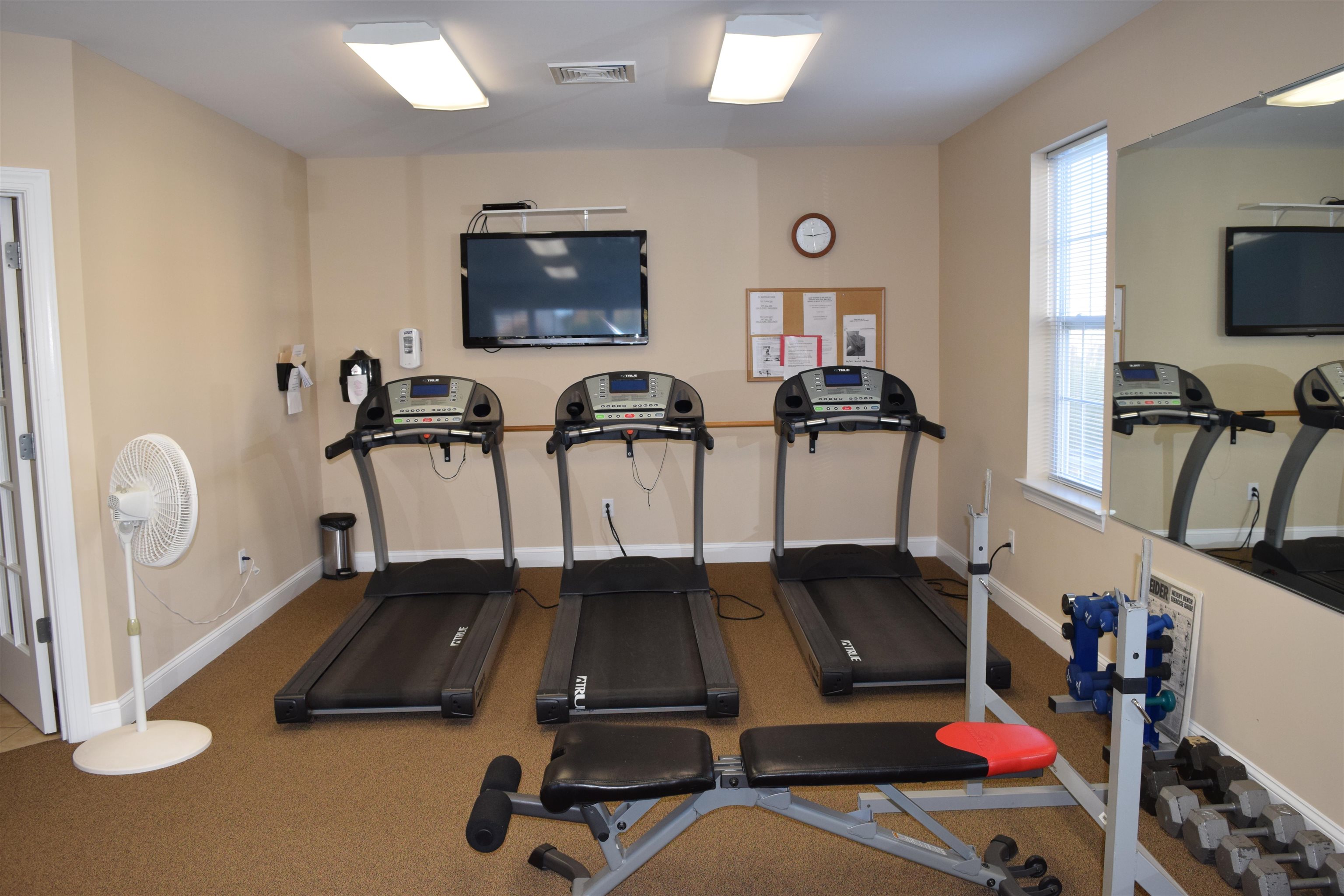 206 Seacrest Lane, Unit 155 Rio Grande, NJ 08242 - Photo 47 of 50 a room with gym equipment and a flat screen tv