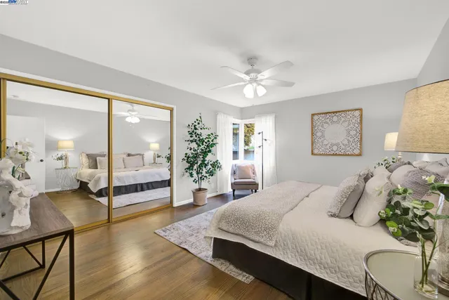 a spacious bedroom with a bed and window