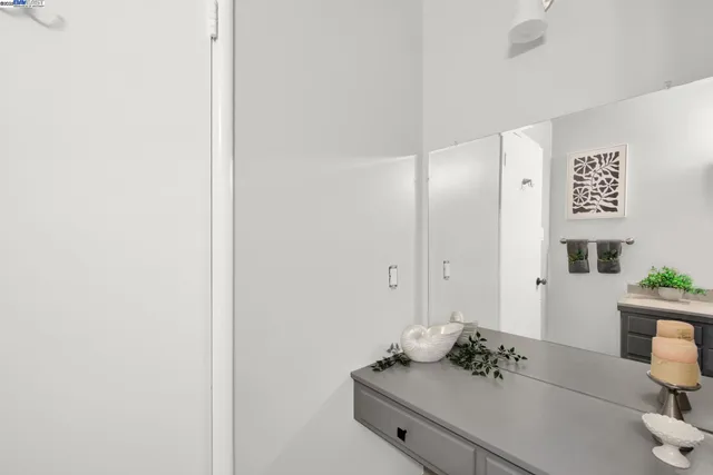 a living room with furniture and flowers