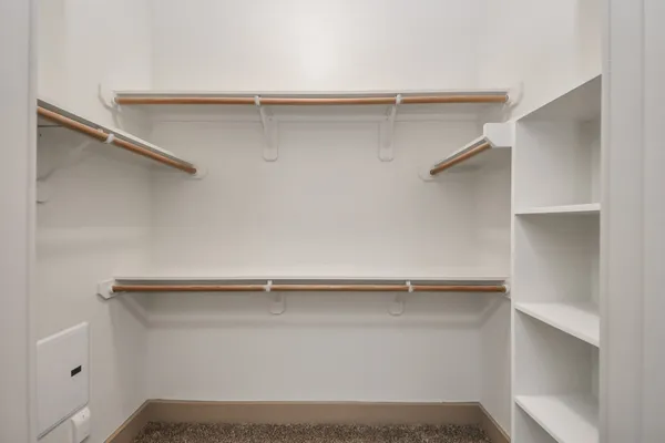 a kitchen with stainless steel appliances kitchen island granite countertop a refrigerator and a stove top oven