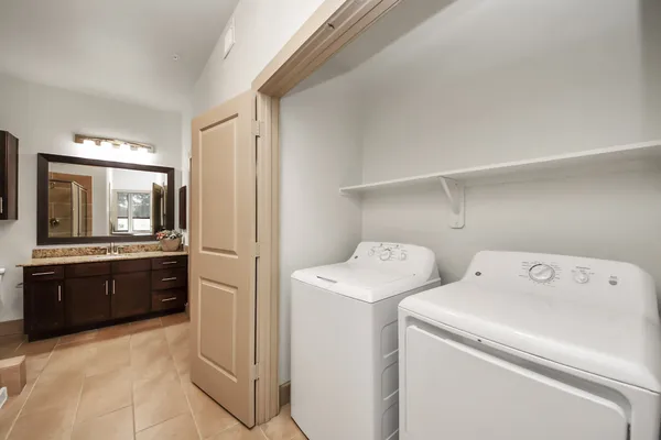a kitchen with stainless steel appliances a refrigerator and a stove top oven