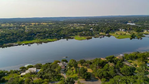 an aerial view of residential building and lake