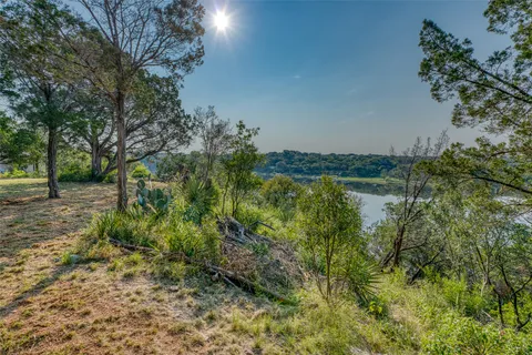 a view of lake with green space