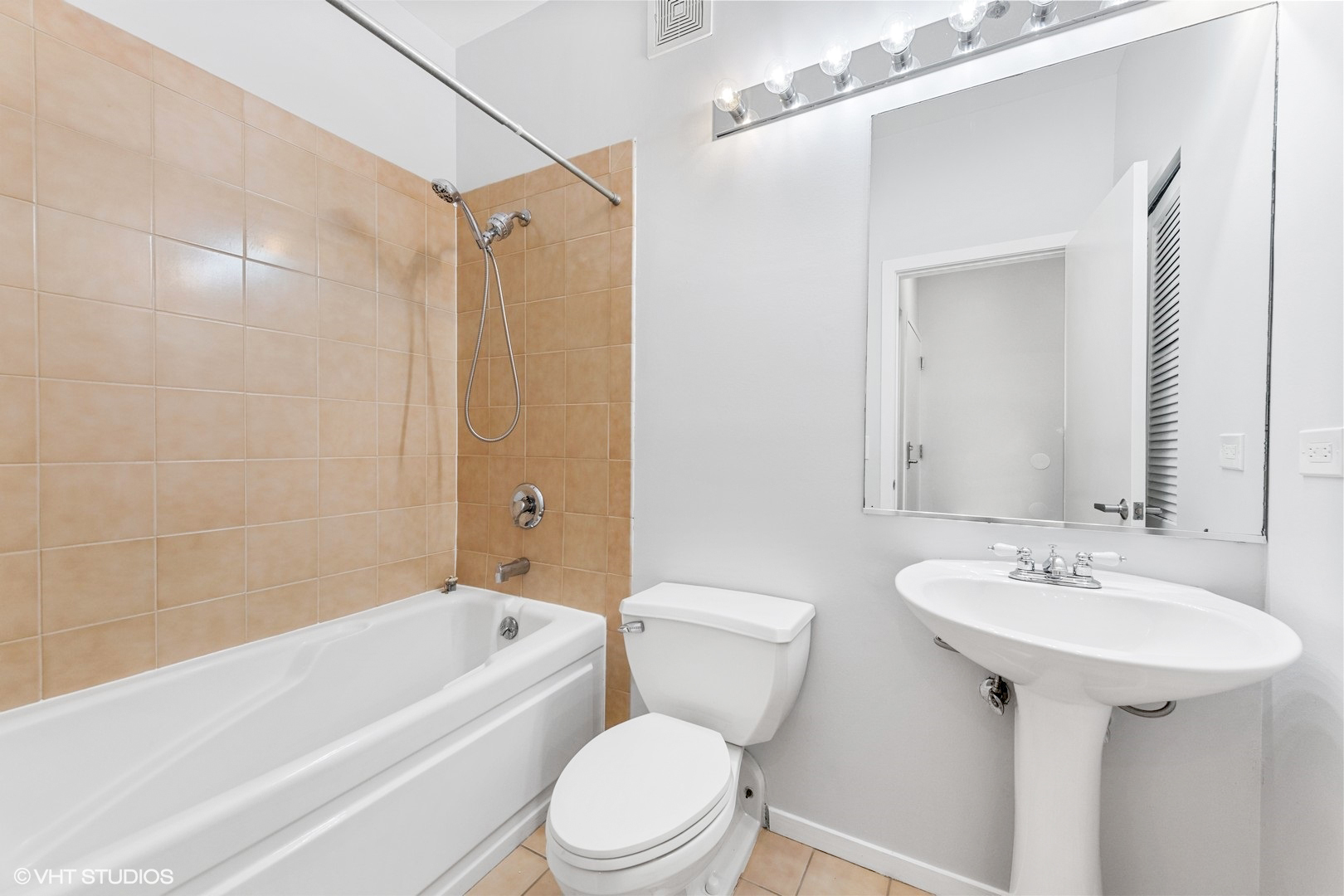 203 South Sangamon Street, Unit 304 Chicago, IL 60607 - Photo 13 of 15 a bathroom with a sink toilet and shower