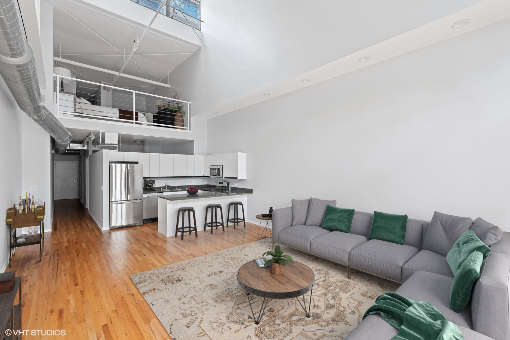 203 South Sangamon Street, Unit 304 Chicago, IL 60607 - Photo 5 of 15 a living room with furniture and a wooden floor
