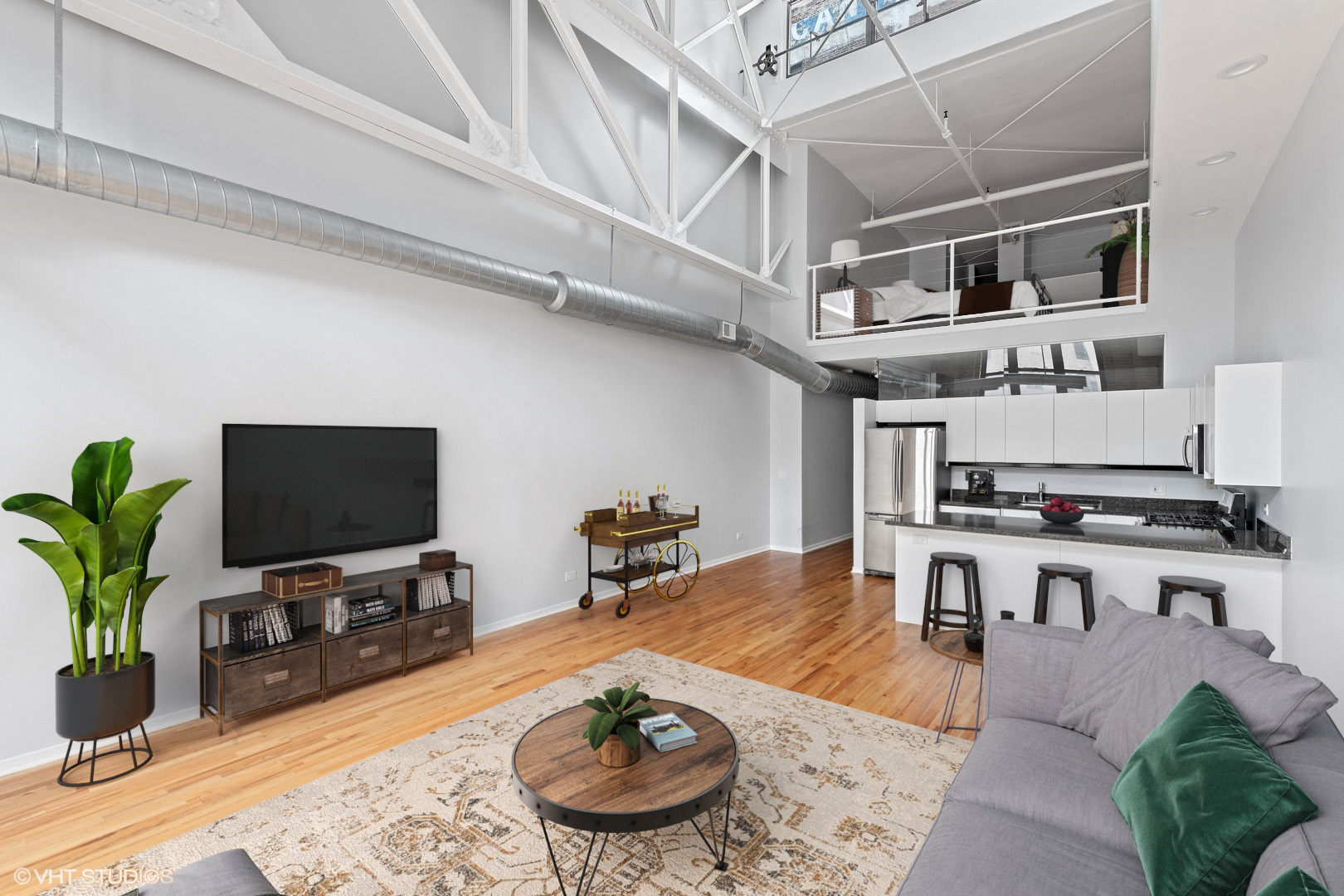 203 South Sangamon Street, Unit 304 Chicago, IL 60607 - Photo 6 of 15 a living room with furniture and a flat screen tv