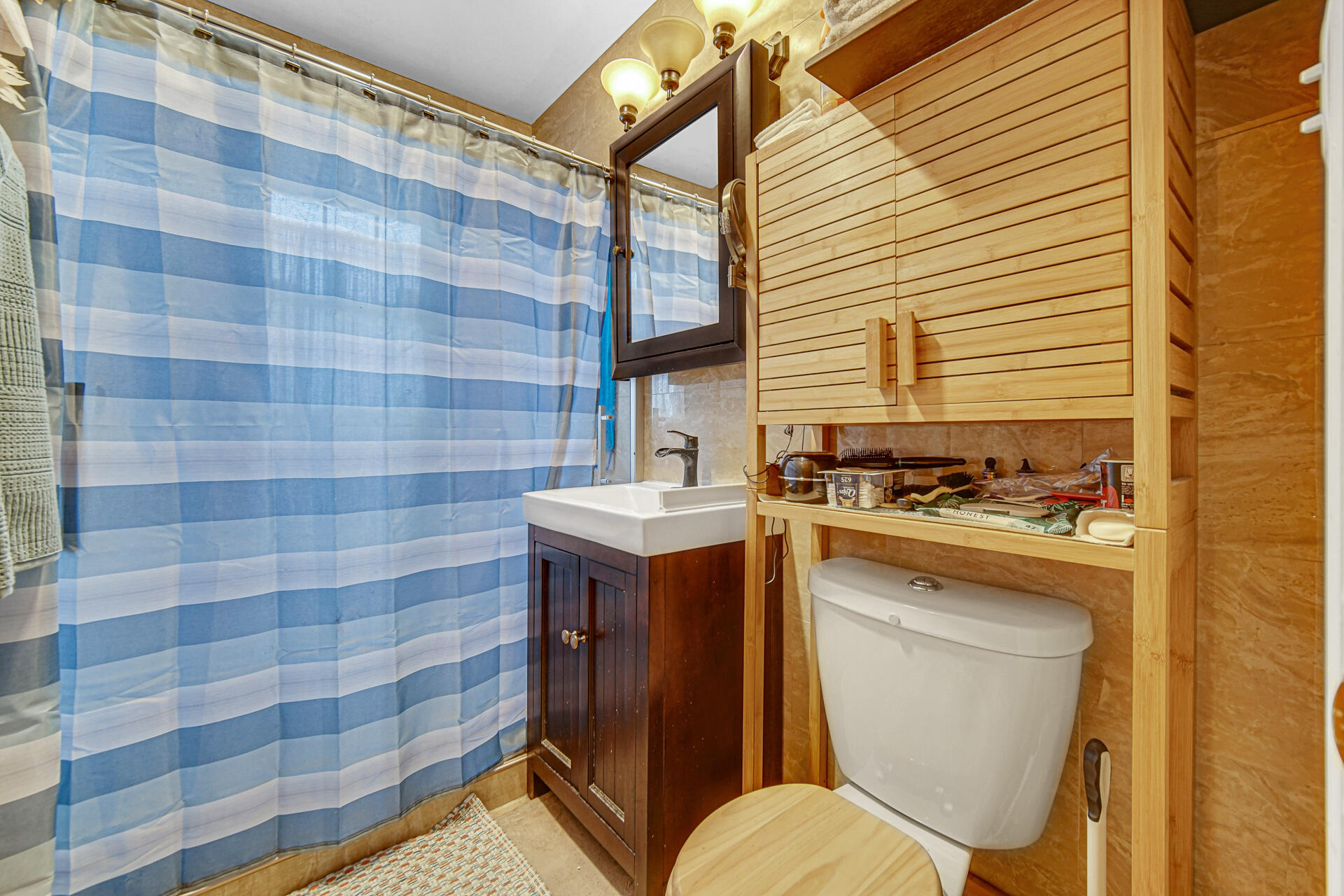 928 176th Street Hammond, IN 46324 - Photo 12 of 25 a bathroom with a sink a toilet and mirror